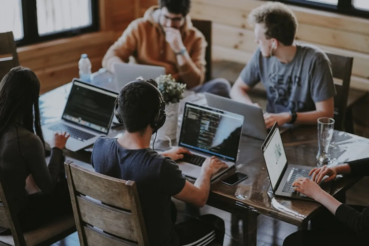 Diverse team collaborating at a modern office workspace